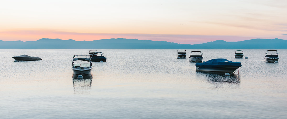 Sunset of Lake Tahoe with boats