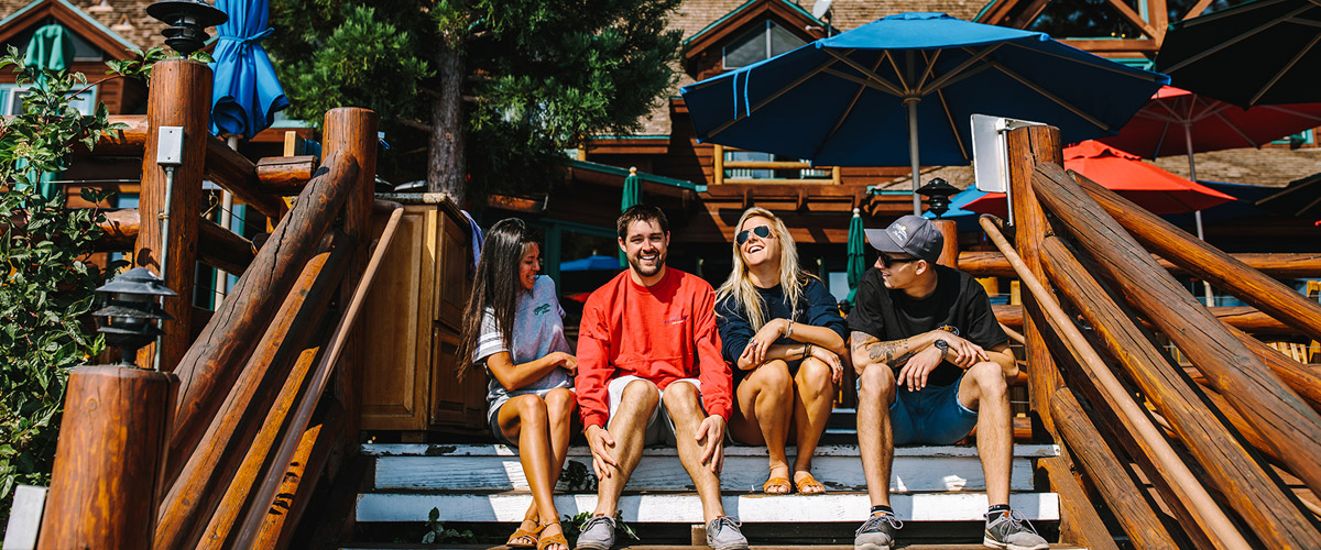 Four friends on the patio at Sunnyside Resort