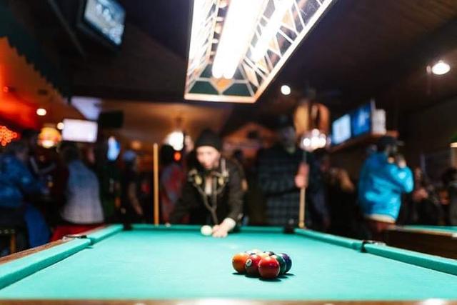 Guy playing pool